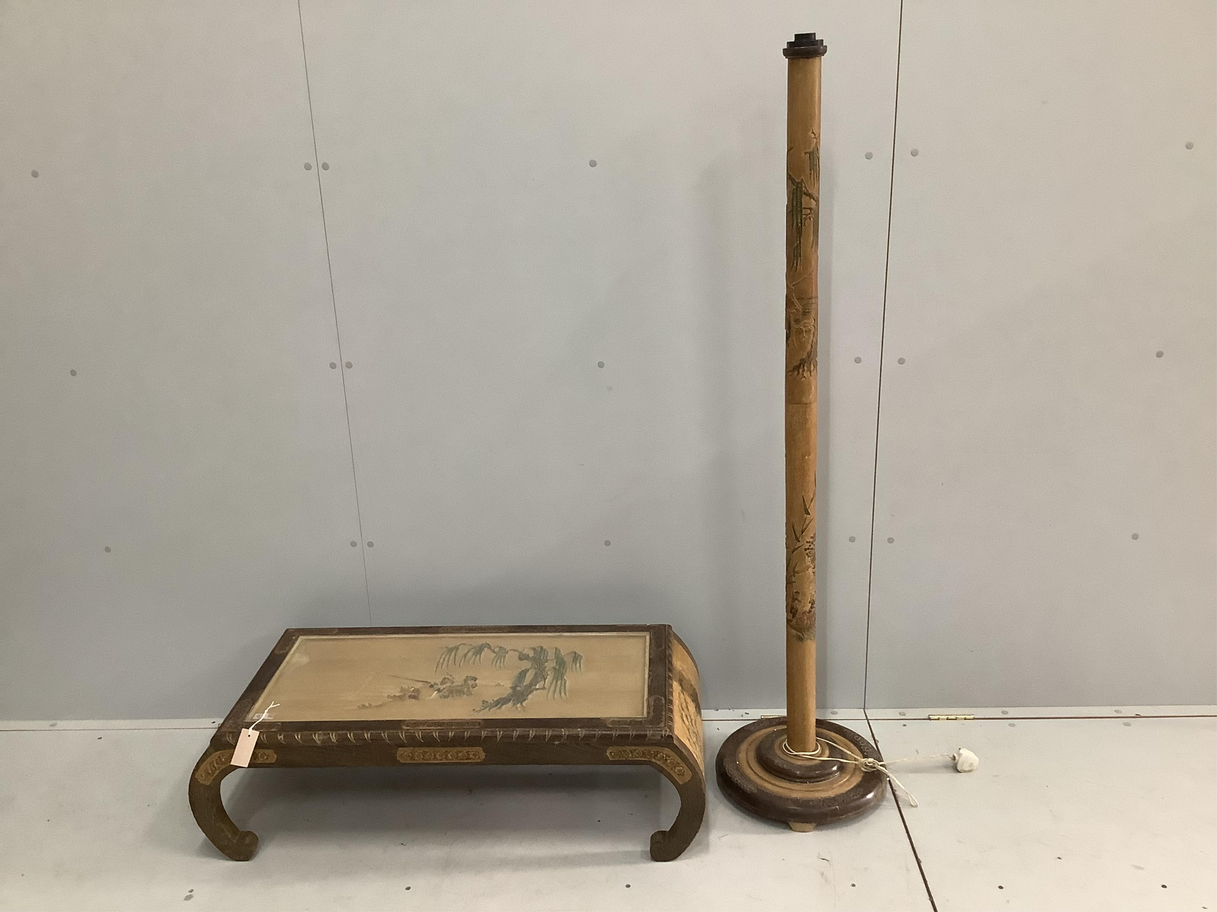 A Malaysian carved hardwood low table, width 102cm, depth 45cm, height 30cm and a standard lamp. Condition - fair
